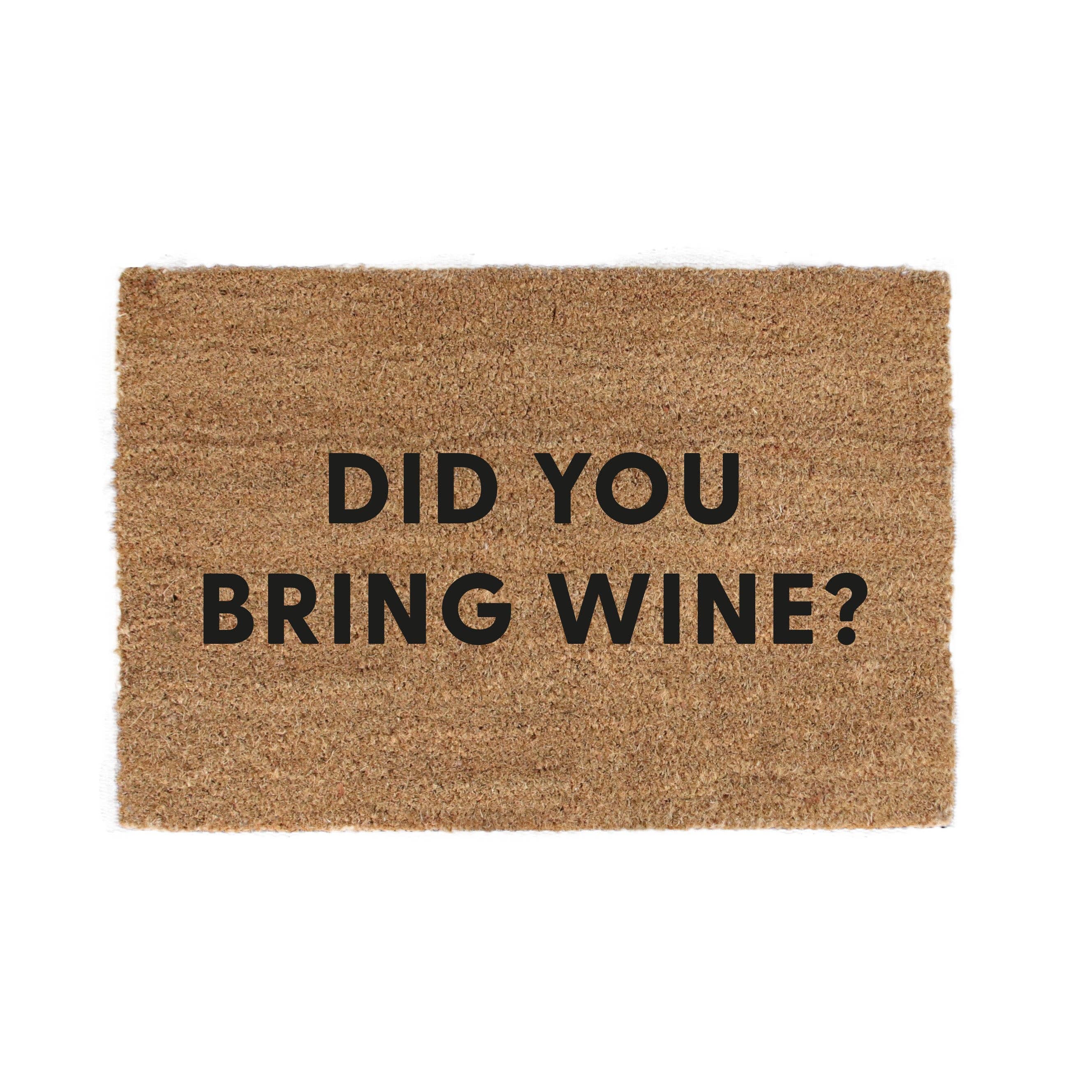 Kokosmåtter “Did you bring wine?” – humor og gæstfrihed ved døren